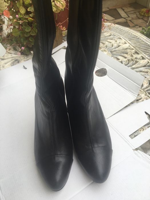 Botas de Cano e salto alto
