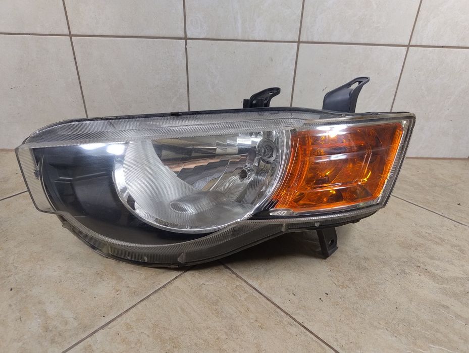 Mitsubishi Colt VI Z30 08- lift lampa reflektor Europa oryginał lewy