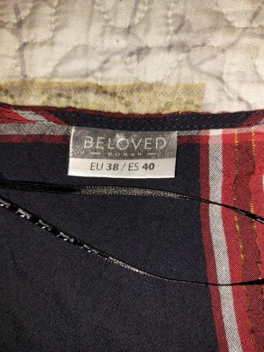 Bluzka w krateczkę z supełkiem na dole