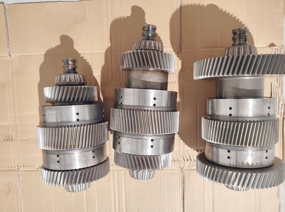 Wałek, koło zębate, kosz New Holland 8670 8770 8870 8970 Ford G170 G190 G210 G240