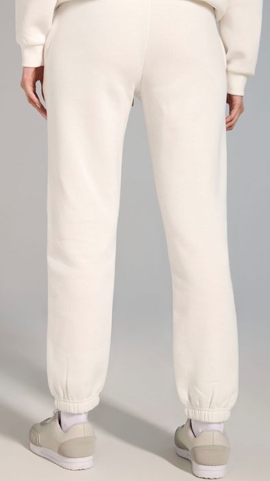 Теплі базові трикотажні кремові спортивні штани Sinsay розмір С-М