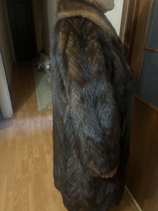 Норкова шуба шита полосами