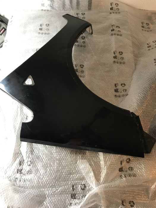 Guarda lamas esquerdo mitsubishi colt