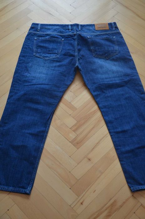 Spodnie dżinsy jeansy Alessandro Salvarini W42 L30 nowe z met. granat