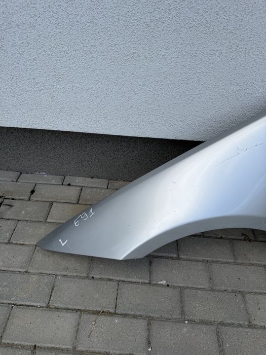 Błotnik przedni lewy BMW E91