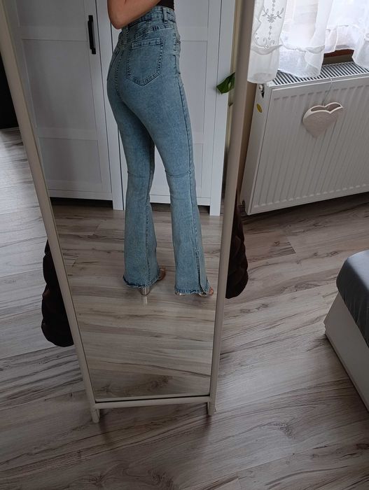 Spodnie jeansowe wysoki stan dzwony rozcięcia spodnie jeansowe