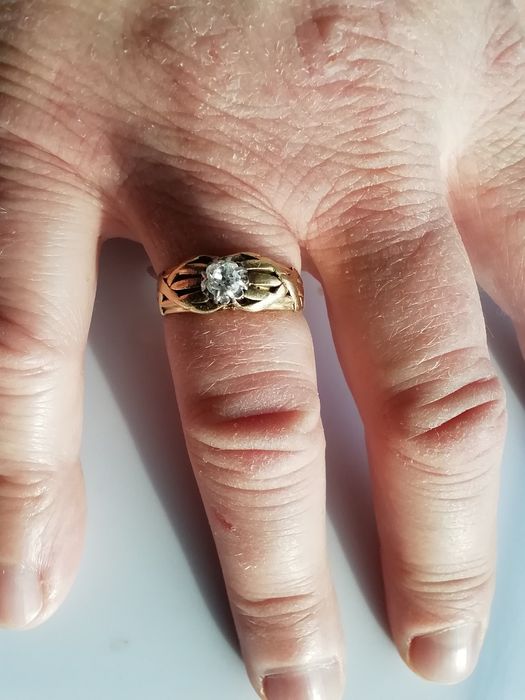 Pierścionek złoty z diamentem rozm. 15 pr. 18 K waga 5,9 g.  Zamienię