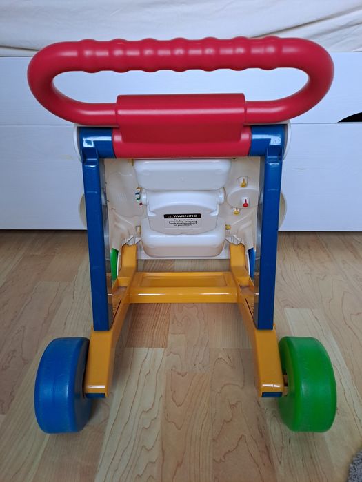 Pchacz do nauki chodzenia. Marka Fisher Price.