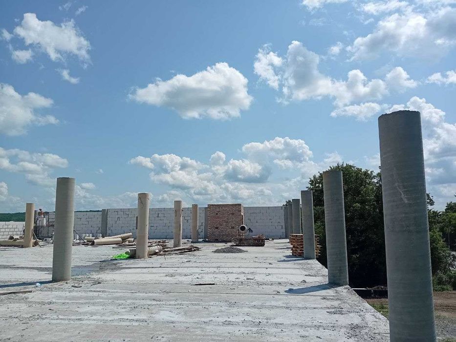 Заливка фундаменту плита стрічковий палі ростверк бетонні  будівництво