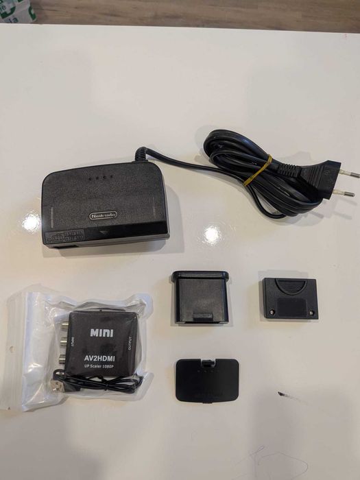 Vários artigos Nintendo 64 (consola, comandos, volante, acessórios)