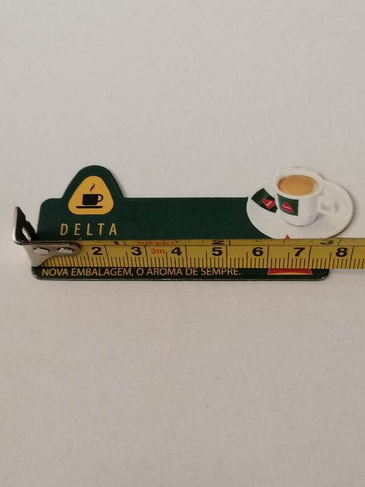 Íman de frigorífico com publicidade da Delta Cafés