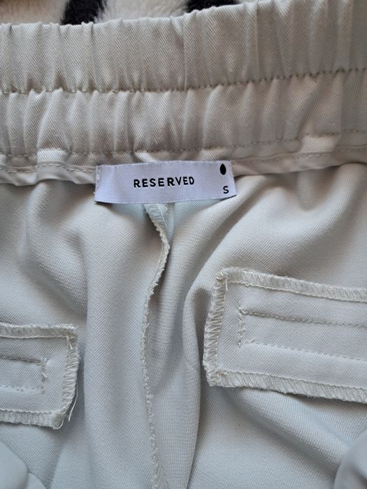 Spodnie damskie jasny beż Reserved S-ka