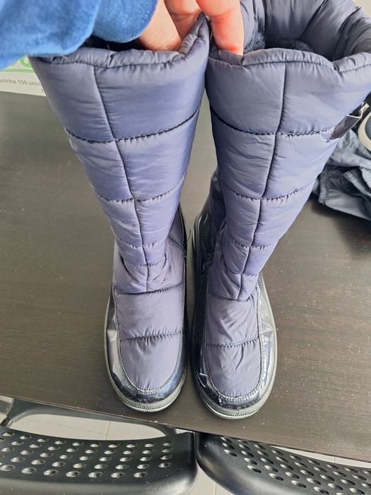 Botas e calças impermeáveis