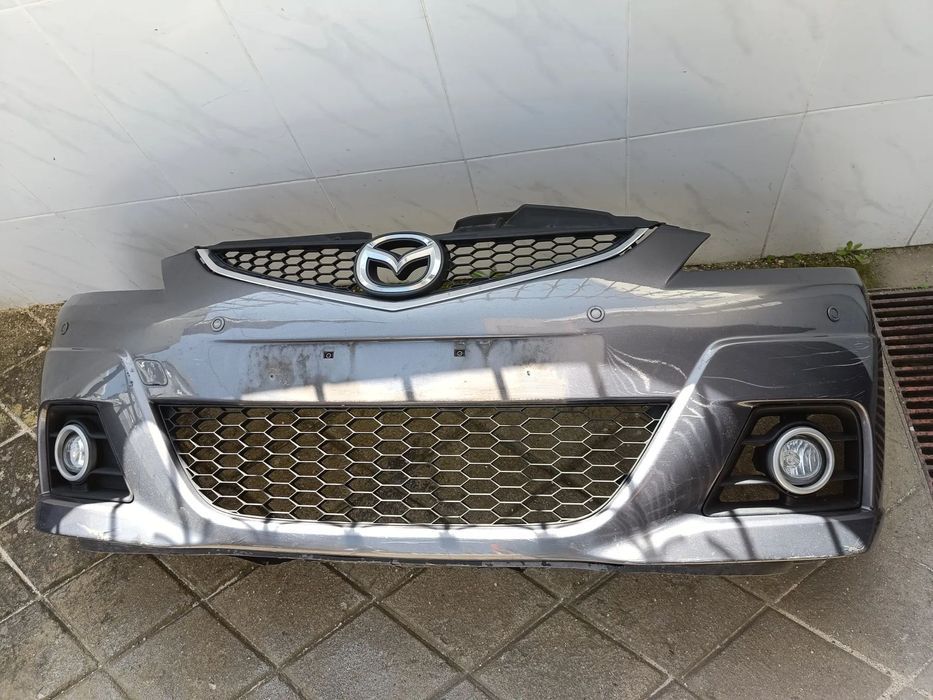 Para choques Mazda 5 2009