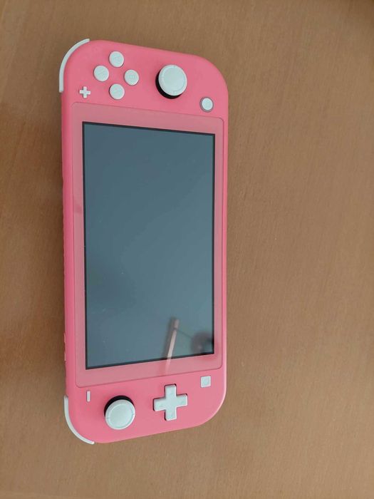 Konsola Nintendo Switch Lite (coral)+ 3 gry: Kao, Smerfy, Sponge Bob