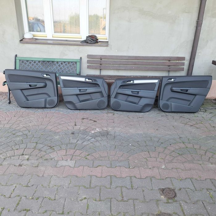 Opel Zafira B  Lift 08- boczki drzwi, podsufitka, osłony przeciwsłoneczne