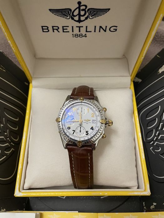 Relogio breitling cronomat aço e ouro e raymond weill modelo othelo.