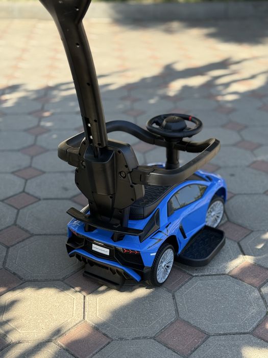 Толокар машинка с ручкой поворотной кожаное сидение музыка Новый