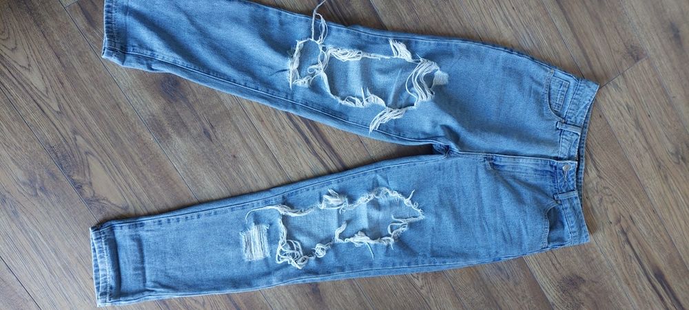 Spodnie jeansowe damskie z rozdarciami Cropp  Xs.