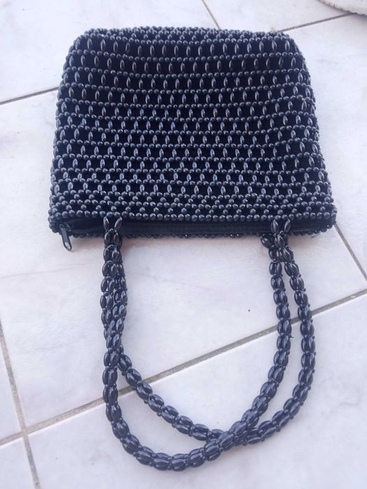 Bolsa preta mão