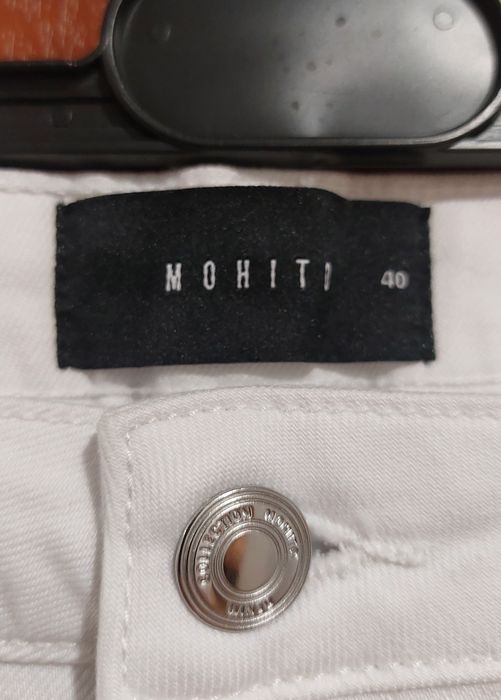 Białe spodnie jeansy Mohito r. 40