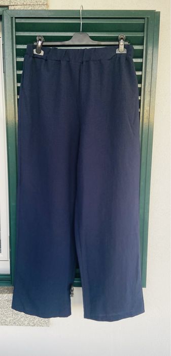 Calças azuis compridas