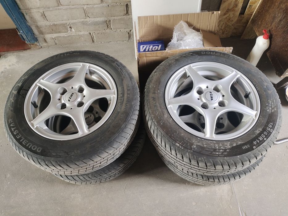Диски 14" 4х100 з гумою 185/65R14 літо, болтами та центрувадьними кільцями 63.4-56.6 ланос, авео, нексія