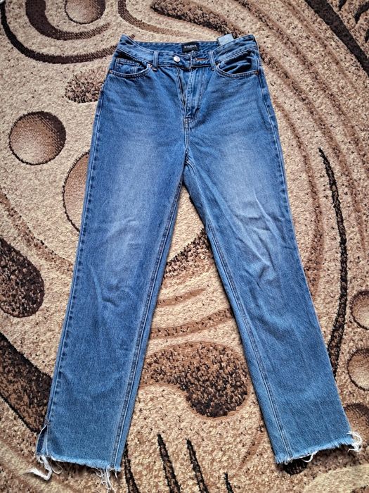 Джинси сині з необробленим краєм