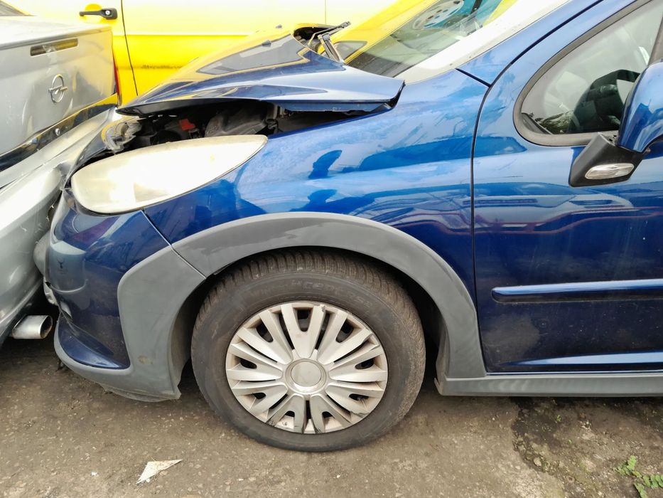 Błotnik przedni lewy PEUGEOT 207 SW Outdoor 06-12r. KPL
