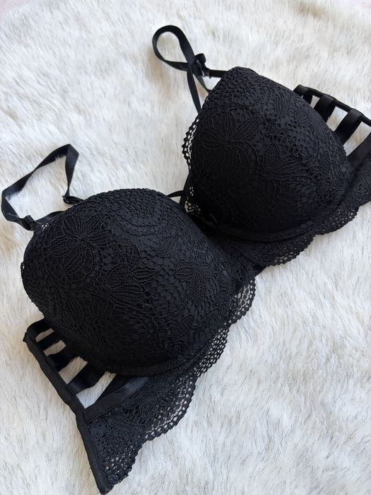 Czarny gorsetowy stanik damski z ozdobnymi paskami 75C