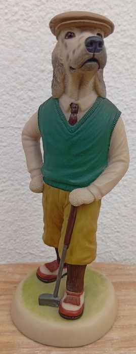 Estatueta de um cão golfista