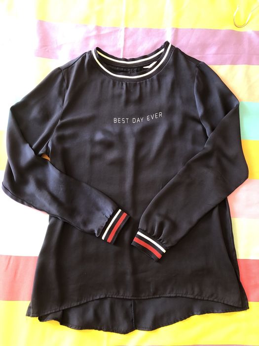 Blusa acetinada Springfield
