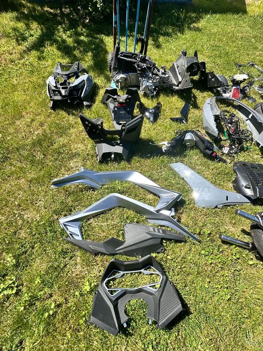 Części do  nowego Sym Cruisym 125 silnik lagi licznik koła owiewki