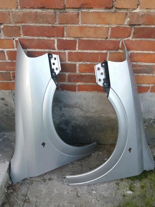 Opel Astra G. Błotniki lewy , prawy Z 147 przód.