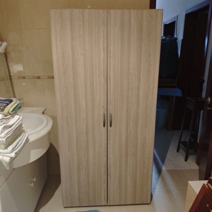 Cream-colored cabinet with shelves