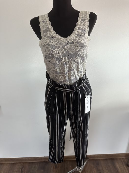 Spodnie zwiewne wiązanie kokardka pionowe paski czarne kuloty na lato