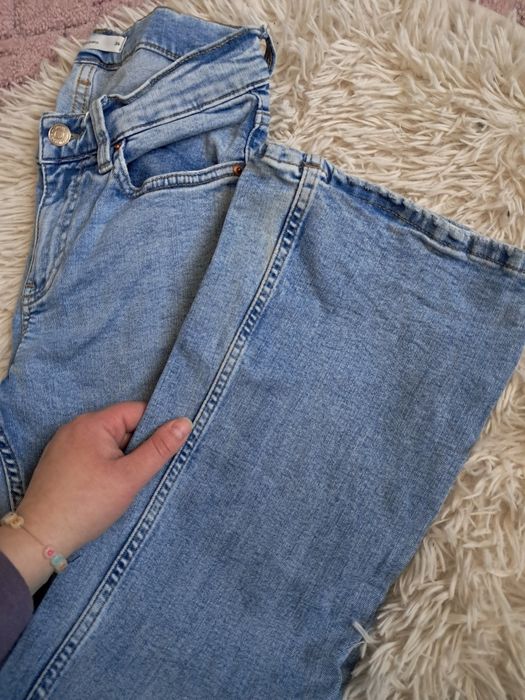 Dzwony jasnoniebieskie jeansowe Ginatricot XS wysoki stan
