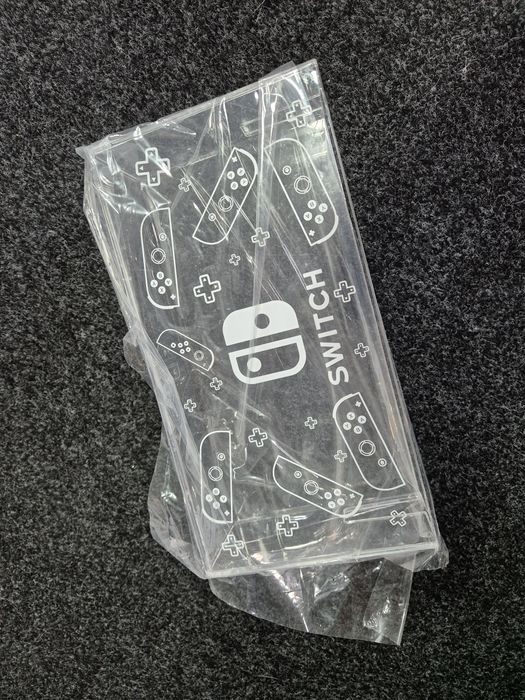 expositor de acrílico transparente para jogos da Nintendo Switch.