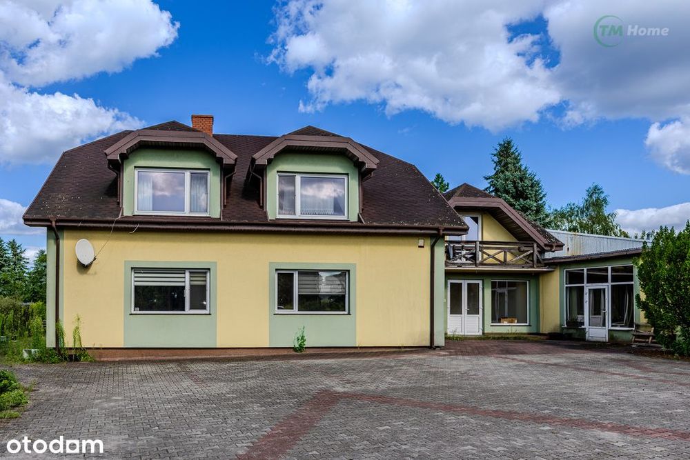 Gostynin dom z budynkiem dla działalności.