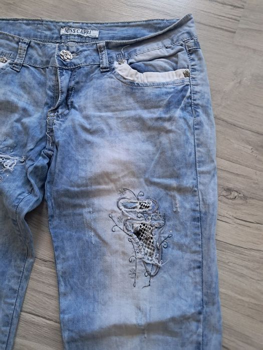 Spodnie jeans z dodatkami damskie