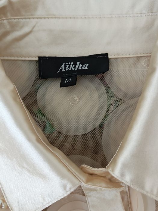 Blusa elegante em cor pérola