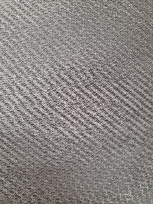 Beżowy materiał syntetyczny (np na spódnice, sukienkę)