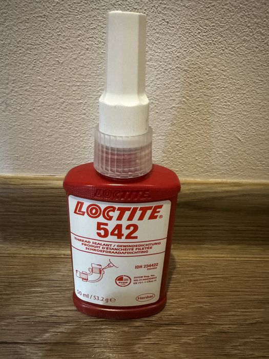 Loctite 542.