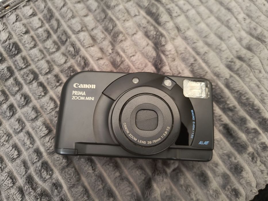Olympus, Konica Minolta, Canon