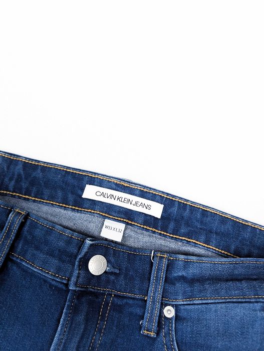 Calvin Klein niebieskie spodnie jeansy 33x32 L