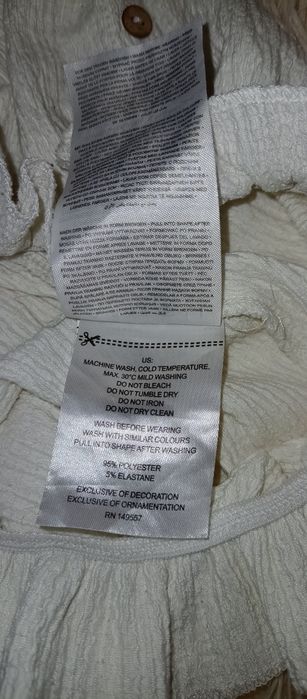 Biała bluzka AMISU rozmiar XS ozdobne guziki marszczona gumką dół