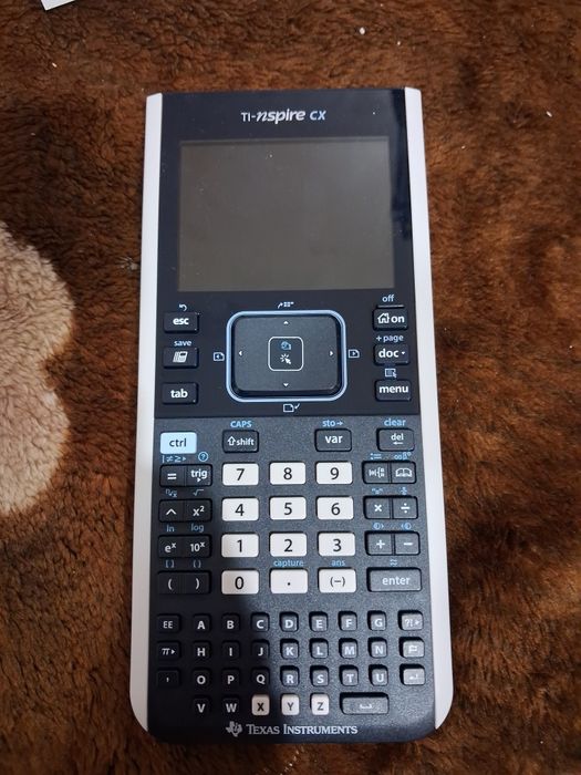 Это графический калькулятор Texas Instruments TI-Nspire CX. 
Он имеет