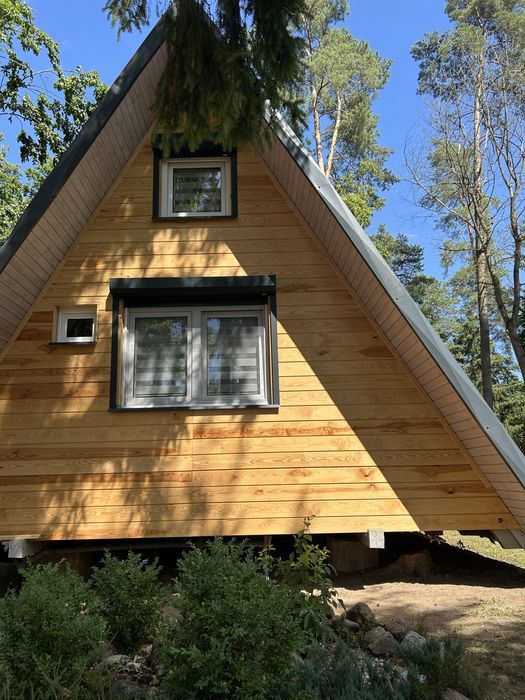 Domek nad jeziorem Warmia i Mazury łódka pomost