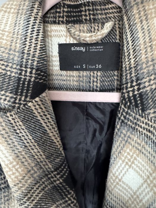 Пальто у клітинку.