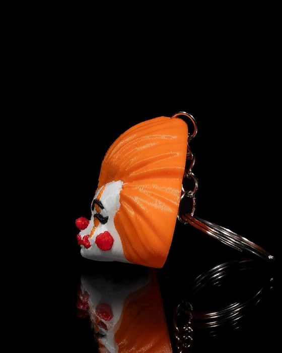 Brelok Pennywise - Ożyw swoje klucze dreszczykiem grozy!